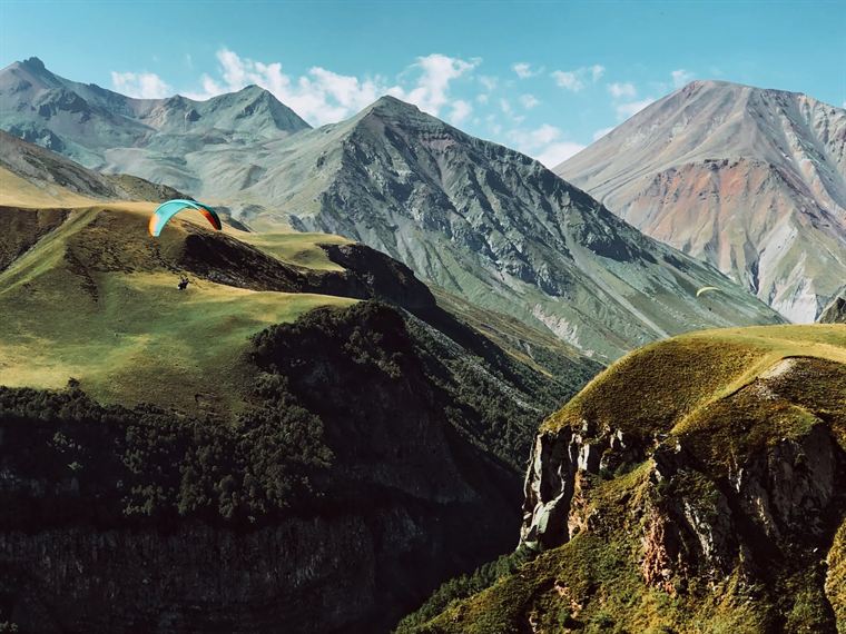 A paraglider on the ridge, Greater Caucasus - photograph by Lika Arobelidze