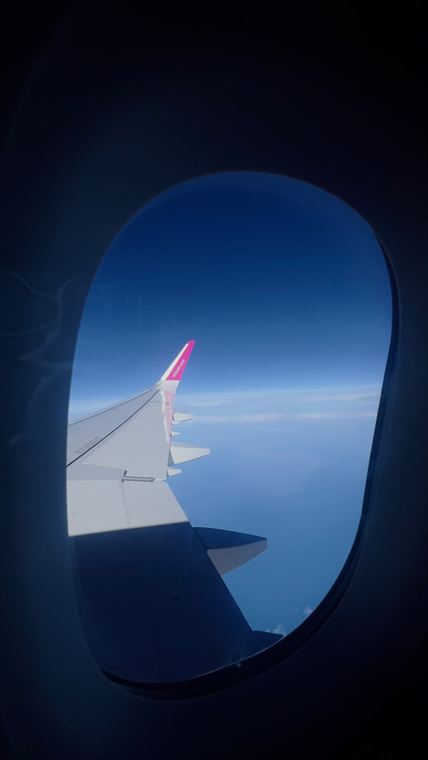 Wing, window, cloud - photograph by Lika Arobelidze