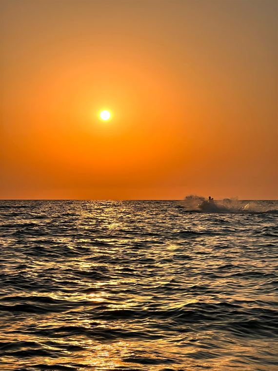 Sunset, open water - photograph by Lika Arobelidze
